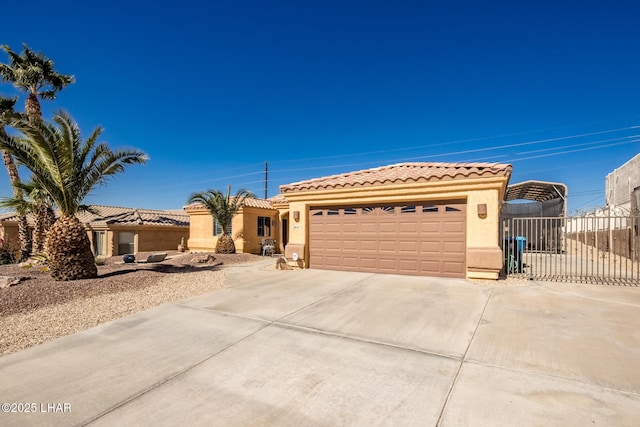 2641 Palo Verde Blvd N, Lake Havasu City, AZ 86404 - mediterranean / spanish home with driveway, a tile roof, and stucco siding