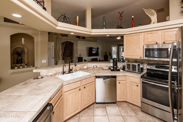 2641 Palo Verde Blvd N, Lake Havasu City, AZ 86404 - kitchen with tile countertops, a peninsula, stainless steel appliances, and a sink