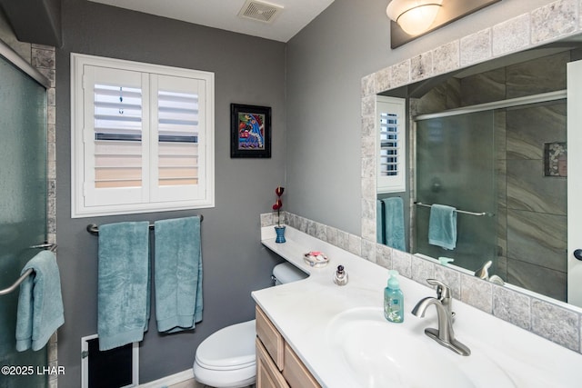 2641 Palo Verde Blvd N, Lake Havasu City, AZ 86404 - bathroom with visible vents, a stall shower, vanity, and toilet