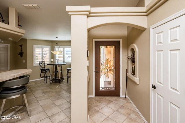 2641 Palo Verde Blvd N, Lake Havasu City, AZ 86404 - entryway featuring light tile patterned floors, arched walkways, visible vents, and baseboards