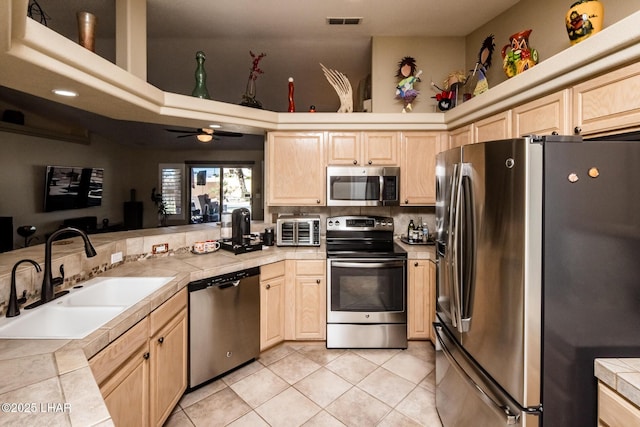 2641 Palo Verde Blvd N, Lake Havasu City, AZ 86404 - kitchen featuring visible vents, tile countertops, appliances with stainless steel finishes, light brown cabinetry, and a sink