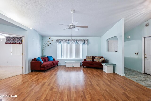 2974 Caravelle Dr, Lake Havasu City, AZ 86406 - sitting room with ceiling fan, light wood-type flooring, a textured ceiling, and vaulted ceiling