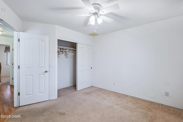 2974 Caravelle Dr, Lake Havasu City, AZ 86406 - unfurnished bedroom featuring carpet flooring, a closet, a ceiling fan, and baseboards