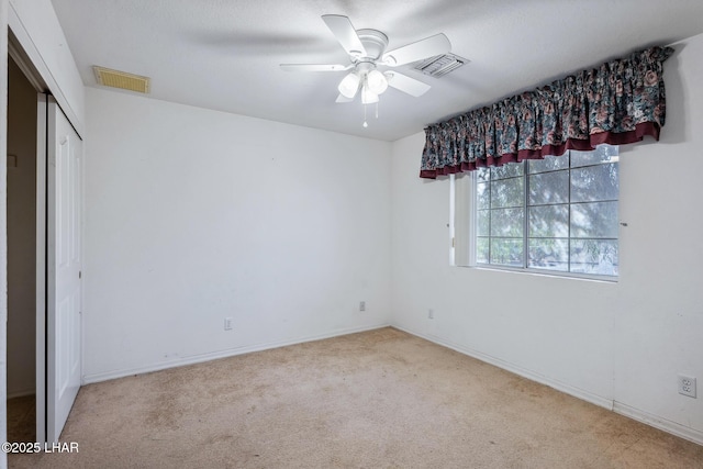 2974 Caravelle Dr, Lake Havasu City, AZ 86406 - unfurnished bedroom featuring carpet flooring, baseboards, a ceiling fan, and a closet