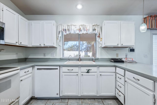 2974 Caravelle Dr, Lake Havasu City, AZ 86406 - kitchen featuring white appliances, a sink, white cabinets, light countertops, and recessed lighting