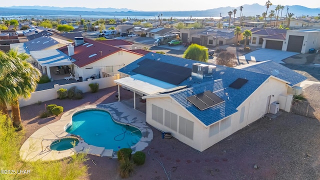 2974 Caravelle Dr, Lake Havasu City, AZ 86406 - aerial perspective of suburban area with a mountain backdrop and a pool area