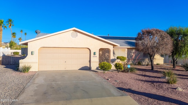 2974 Caravelle Dr, Lake Havasu City, AZ 86406 - single story home with driveway, stucco siding, an attached garage, and roof mounted solar panels