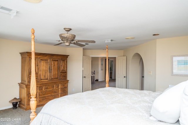 1351 London Bridge Rd Unit 2, Lake Havasu City, AZ 86404 - carpeted bedroom featuring visible vents, arched walkways, baseboards, and ceiling fan