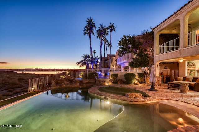 1351 London Bridge Rd Unit 2, Lake Havasu City, AZ 86404 - view of swimming pool with a fenced in pool, fence, exterior kitchen, and a patio