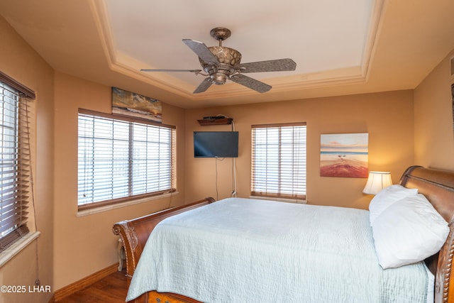 1351 London Bridge Rd Unit 2, Lake Havasu City, AZ 86404 - bedroom featuring baseboards, a ceiling fan, a tray ceiling, and wood finished floors