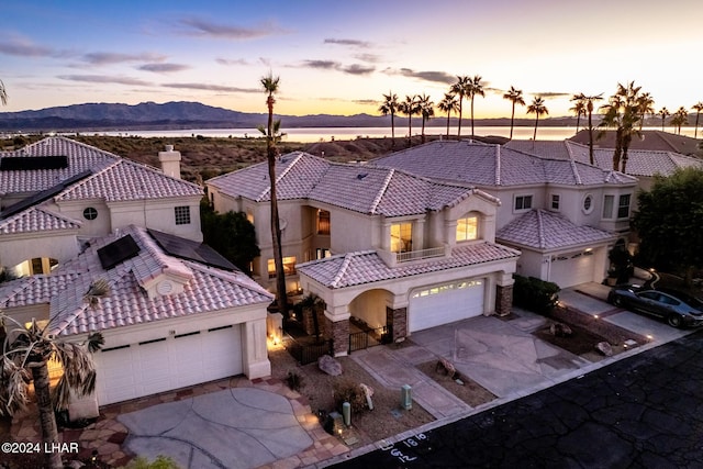 1351 London Bridge Rd Unit 2, Lake Havasu City, AZ 86404 - aerial view at dusk featuring a mountain view