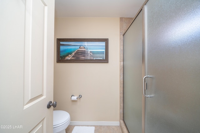 1351 London Bridge Rd Unit 2, Lake Havasu City, AZ 86404 - full bath with baseboards, tile patterned flooring, toilet, and a shower stall