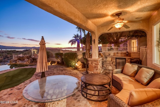 1351 London Bridge Rd Unit 2, Lake Havasu City, AZ 86404 - view of patio featuring an outdoor living space, a ceiling fan, fence, and an outdoor kitchen