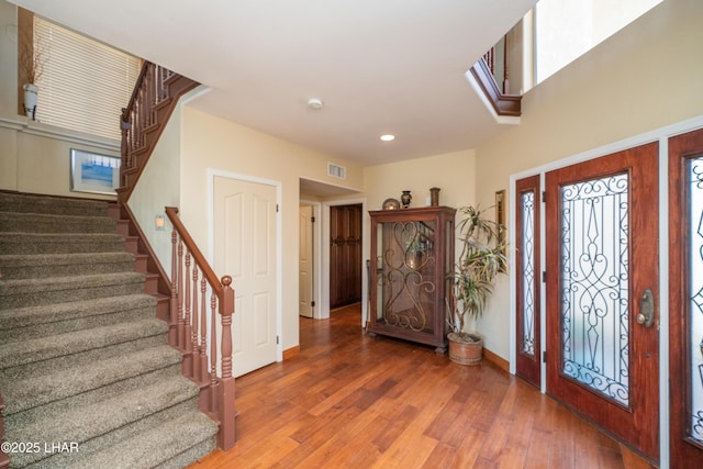 1351 London Bridge Rd Unit 2, Lake Havasu City, AZ 86404 - foyer with visible vents, wood finished floors, stairway, baseboards, and recessed lighting