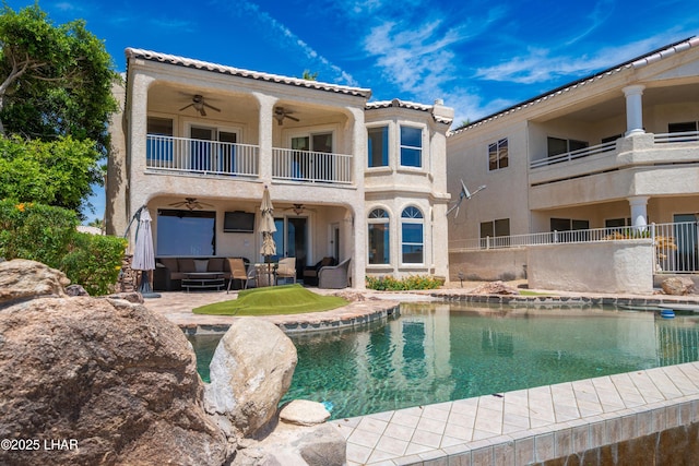 1351 London Bridge Rd Unit 2, Lake Havasu City, AZ 86404 - back of property featuring an outdoor hangout area, ceiling fan, stucco siding, a balcony, and a patio
