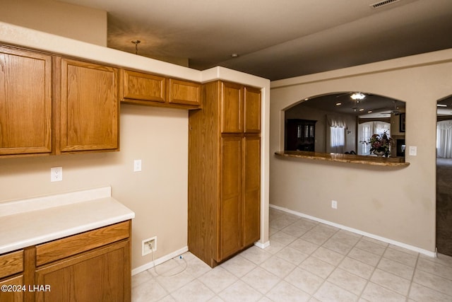 kitchen with light tile patterned flooring