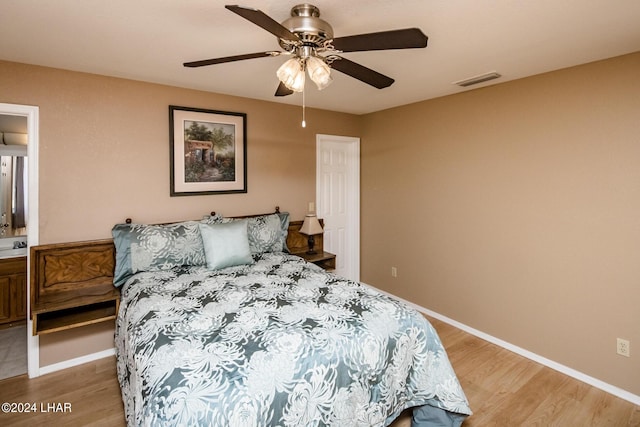 bedroom featuring hardwood / wood-style floors and ceiling fan