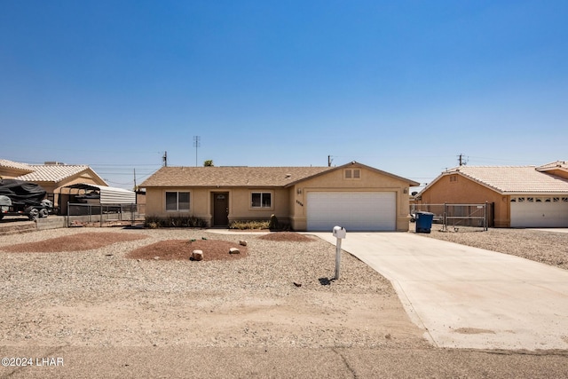 ranch-style home featuring a garage