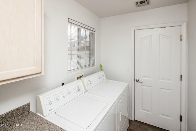 laundry room with visible vents, separate washer and dryer, and laundry area