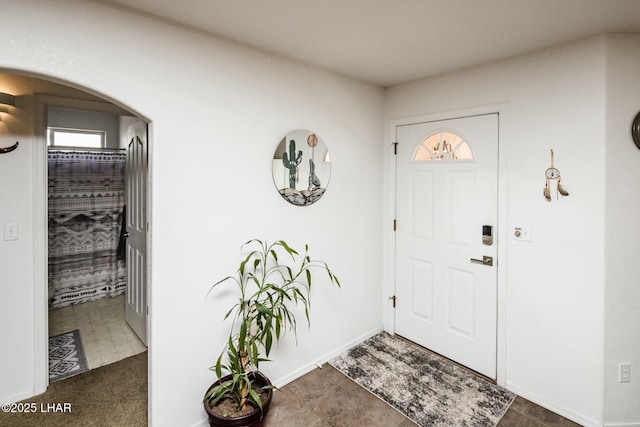 foyer featuring arched walkways