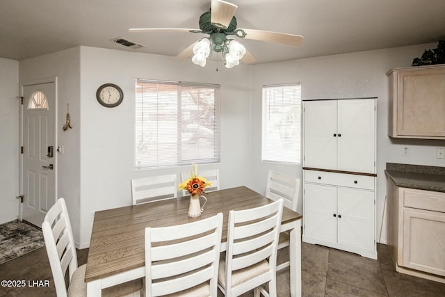 dining area with visible vents and a ceiling fan