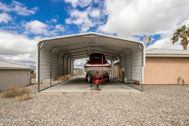 view of vehicle parking featuring a carport and driveway