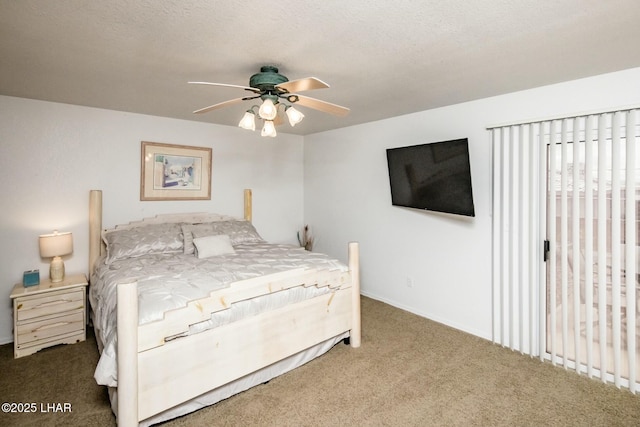 bedroom with a textured ceiling, ceiling fan, and carpet flooring