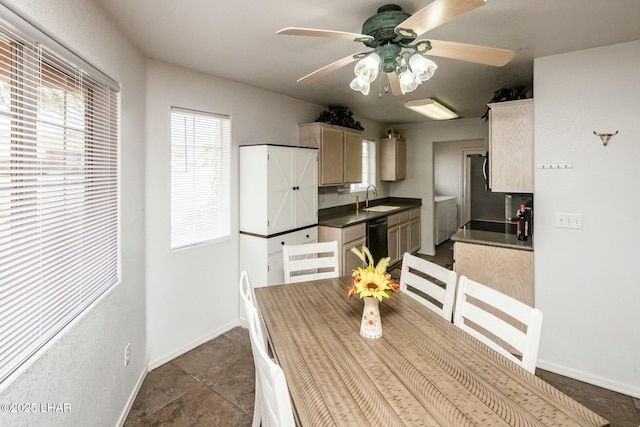 dining space with baseboards and a ceiling fan