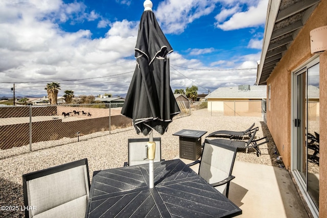 view of patio / terrace featuring outdoor dining area and a fenced backyard