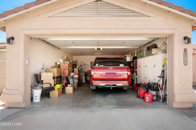 3712 Tahitian Dr, Lake Havasu City, AZ 86406 - garage with concrete driveway and a garage door opener