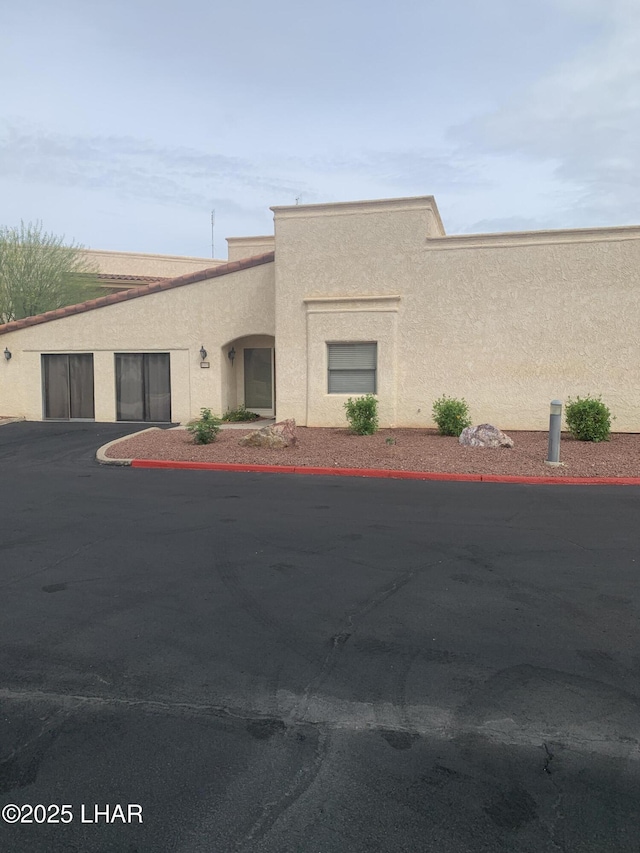 1008 Barcelona Unit 1, Lake Havasu City, AZ 86403 - view of front of property featuring stucco siding and uncovered parking