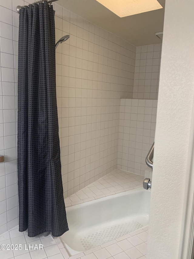 1008 Barcelona Unit 1, Lake Havasu City, AZ 86403 - bathroom with tiled shower / bath and tile patterned flooring