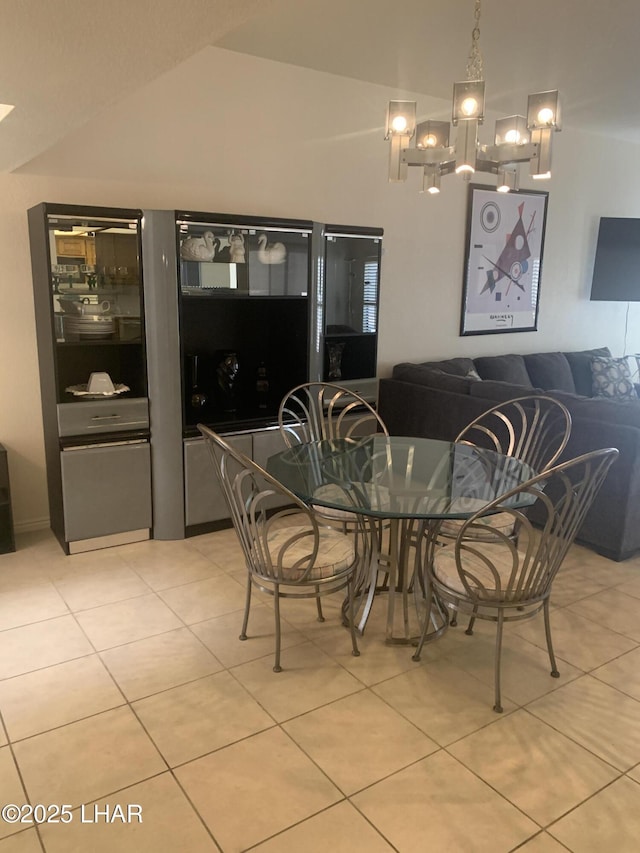 1008 Barcelona Unit 1, Lake Havasu City, AZ 86403 - dining room featuring light tile patterned floors, a chandelier, and vaulted ceiling