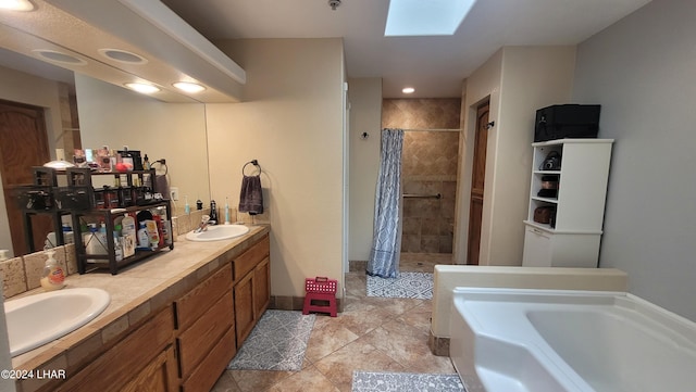 bathroom featuring vanity, plus walk in shower, and a skylight