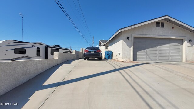 view of side of home featuring a garage