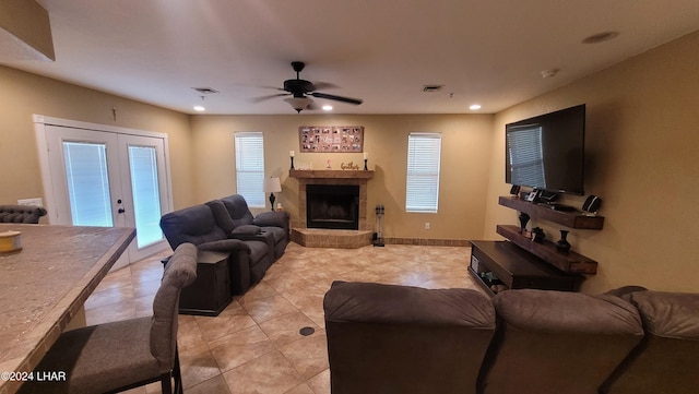 living room featuring french doors and ceiling fan