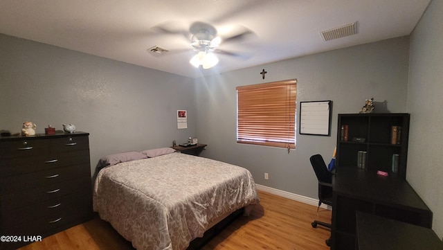 bedroom with ceiling fan and light wood-type flooring