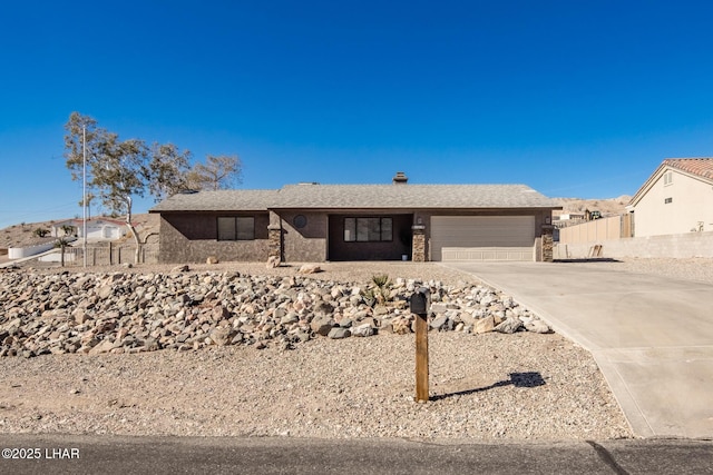 ranch-style home featuring a garage