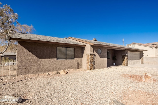 back of house with a garage