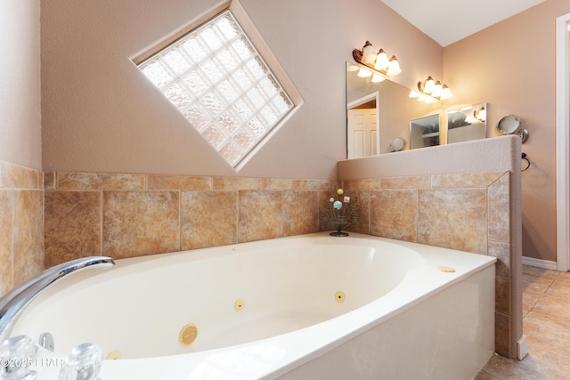 bathroom featuring a jetted tub and tile patterned floors