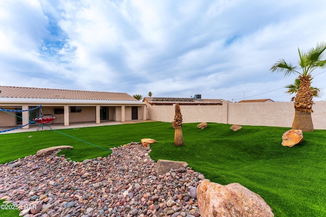 view of yard featuring a patio and fence