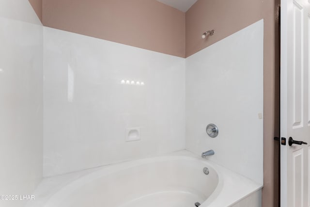 bathroom with a shower and a bathing tub