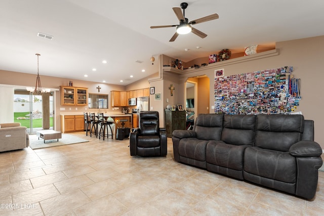 living area with visible vents, arched walkways, ceiling fan with notable chandelier, vaulted ceiling, and recessed lighting