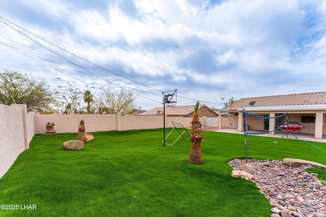 view of yard featuring a patio and a fenced backyard