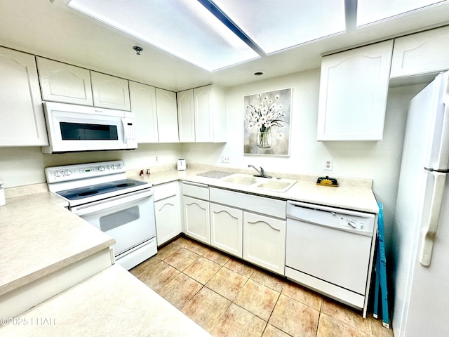 2085 Mesquite Ave Unit 61, Lake Havasu City, AZ 86403 - kitchen with white appliances, white cabinets, light tile patterned floors, and a sink