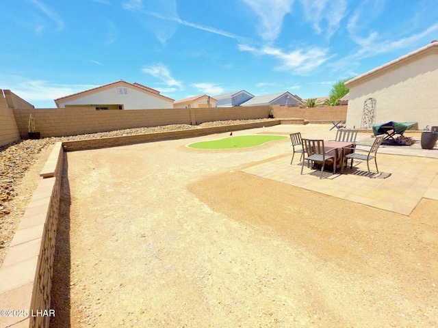 2550 E Nez Perce Rd, Fort Mohave, AZ 86426 - fenced backyard with a putting green and a patio