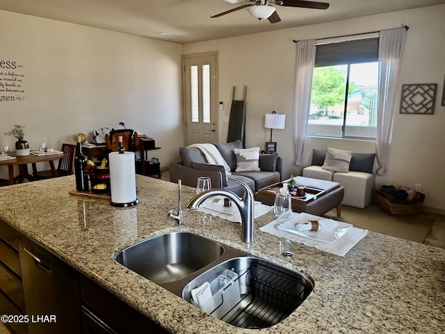 2550 E Nez Perce Rd, Fort Mohave, AZ 86426 - kitchen featuring ceiling fan, open floor plan, dishwashing machine, and light stone counters