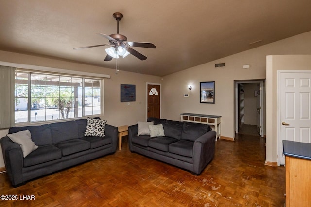 2613 Packet Ln, Lake Havasu City, AZ 86403 - living room with baseboards, visible vents, vaulted ceiling, and a ceiling fan