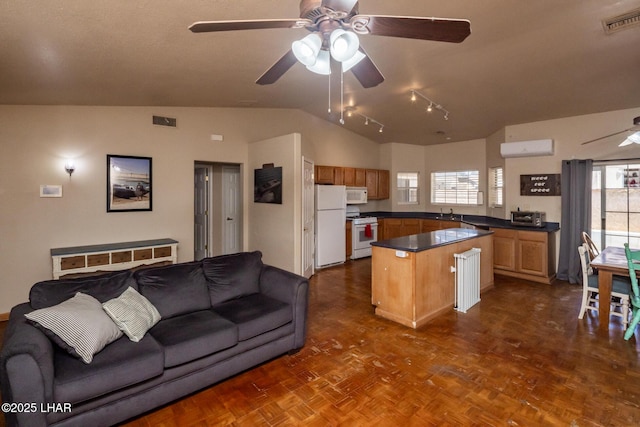 2613 Packet Ln, Lake Havasu City, AZ 86403 - kitchen featuring visible vents, ceiling fan, white appliances, and vaulted ceiling