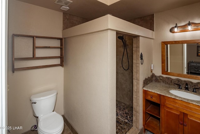2613 Packet Ln, Lake Havasu City, AZ 86403 - full bathroom featuring vanity, visible vents, walk in shower, and toilet